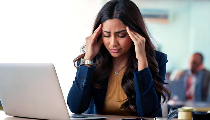 Woman with headache or migraine seeking chiropractic treatment options